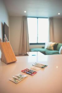 a table with three magazines on top of it at Luxurious 2 Bed - RIVER VIEW in Liverpool