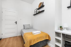 Giường trong phòng chung tại Prime Home CENTRUM 2