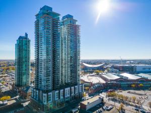 an aerial view of a city with tall buildings at Walk to Bars, Casino, Stampede & Saddledome PLUS FREE Bonus Banff Pass, Parking & Wine! in Calgary