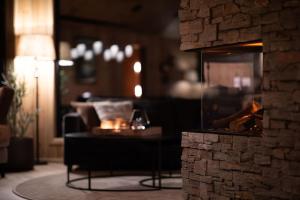 a living room with a couch and a fireplace at The View - Hodlekve in Sogndal