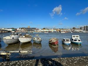 a group of boats are docked in a harbor at House few mins from beach with hot tub & sauna in Shoreham-by-Sea