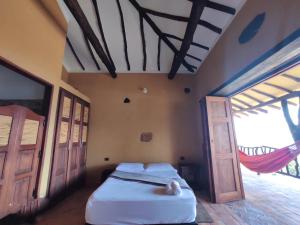En eller flere senge i et værelse på Casa Hermosa Vista Barichara