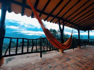 a hammock with a view of the ocean at Casa Hermosa Vista Barichara in Barichara