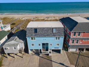 an aerial view of a house and the beach at Pure Paradise Kure Beach, Ocean front, Pool coming soon! in Kure Beach