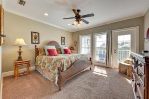 a bedroom with a bed and a ceiling fan at St Marys Townhome with Community Hot Tub and Boat Dock in Saint Marys