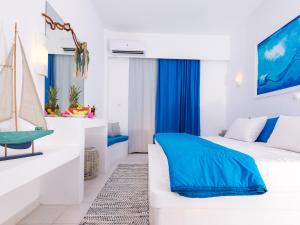 Postel nebo postele na pokoji v ubytování Mojito Beach Rooms