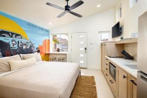 a bedroom with a bed and a ceiling fan at Downtown Kokopelli West 5 - Newly Remodeled Stylish Studio in Moab