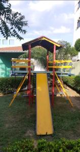 a playground with a slide in a park at Apartamento Mossoró in Mossoró