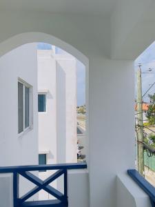 a view from a window of a white building at Playa Azul House in Bayahibe