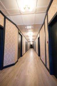 a corridor in an office building with a long hallway at Speakeasy Queen Suite (Rm 7) in Nevada City
