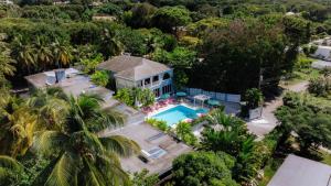 an aerial view of a house with a swimming pool at The Palms Resort in Saint James