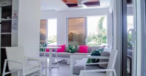 a living room with a couch and a table at The Palms Resort in Saint James