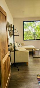Una cama o camas en una habitación de Sunshine Sanctuary Boutique Jungle Lodge
