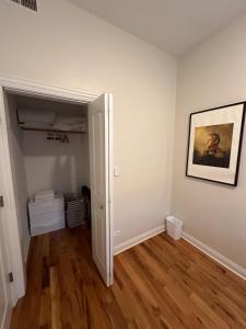 an empty room with a painting on the wall at Flexhome Wicker Park 3BR DV1 - READ INFO in Chicago