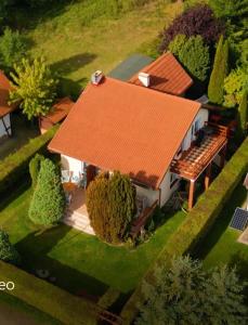an aerial view of a house with an orange roof at Holiday Home Kubus in Poddąbie