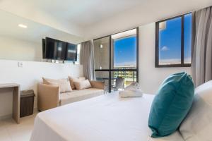 Katil atau katil-katil dalam bilik di Makia Beach #C309 - em Muro Alto por Carpediem +28 gambar