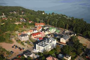 an aerial view of a town with buildings and the water at Hotel ARA - Dancing Club Restauracja Kameralne SPA ARA in Jastrzębia Góra