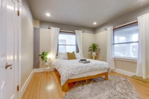 a bedroom with a bed and two windows at Sacramento Home about 2 Mi to Downtown! in Sacramento