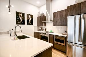 a kitchen with a stainless steel refrigerator and cabinets at Lupfer Luxury in Whitefish