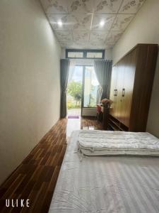 Postel nebo postele na pokoji v ubytování Homestay Chân Quê