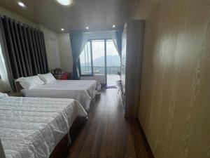 Postel nebo postele na pokoji v ubytování Homestay Chân Quê