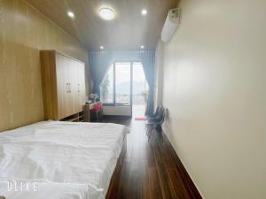 Postel nebo postele na pokoji v ubytování Homestay Chân Quê
