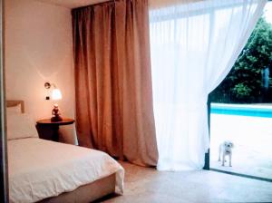 A bed or beds in a room at Rome villa swimming pool