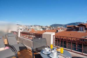 a table and chairs on a balcony with a view at Best Western Plus Hôtel Massena Nice in Nice