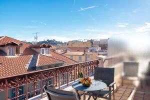 a balcony with a table and chairs on a balcony at Best Western Plus Hôtel Massena Nice in Nice