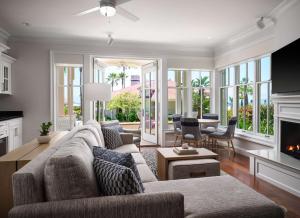 a living room with a couch and a fireplace at Beach Village at The Del, Curio Collection by Hilton in San Diego