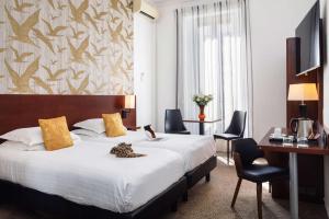 Postel nebo postele na pokoji v ubytování Best Western Plus Hôtel Brice Garden Nice