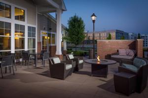 a patio with couches and tables and chairs at Residence Inn by Marriott Columbus Polaris in Columbus