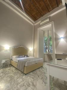 Postel nebo postele na pokoji v ubytování MILUAR Luxury B&B - Vanvitelli + 38 fotografií