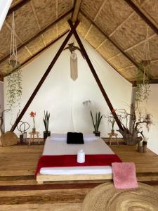 a bedroom with a bed in a tent at Harmony Healing Project - Connect With Your Divinity in El Nido