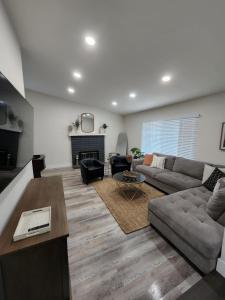 a living room with a couch and a fireplace at Pampas House in Las Vegas