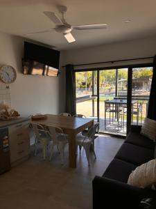a kitchen and dining room with a table and chairs at Bundalong Villas in Bundalong