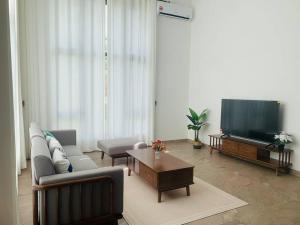 TV/Unterhaltungsangebot in der Unterkunft 【森林城市高尔夫】度假式双层别墅民宿