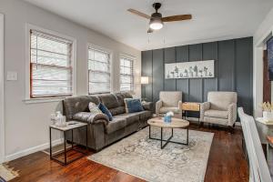 a living room with a couch and two chairs at Chic Home with Huge Grassy Yard 7 mins to Arrowhead Stadium in Independence