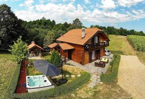 an overhead view of a house with an umbrella at Family friendly house with a parking space Mihalic Selo, Karlovac - 22351 in Duga Resa