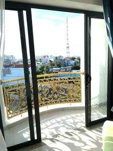 a balcony with a view of a city at HA ANH PHAN THIẾT HOTEL in Phan Thiet +7 photos