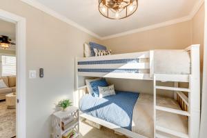 a bedroom with bunk beds in a house at Lakefront Highland Home with Dock about 2 Mi to Milford! 