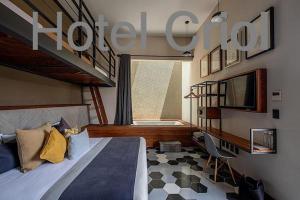 a bedroom with a large bed and a staircase at Hotel Criol in Querétaro