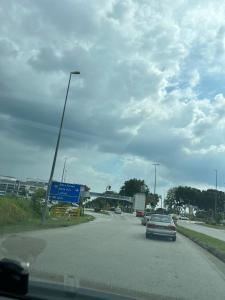a car is driving down a highway with cars at SohoMimi Seri Iskandar in Kampung Bota Kiri