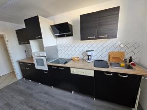 a kitchen with a sink and a counter top at Duisburg Zentral Nord in Duisburg