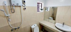 a bathroom with a shower and a toilet and a sink at Chloe's Homestay - Baguio Spacious 3BR Corner Rowhouse for Family & Friends Getaways in Baguio +28 photos