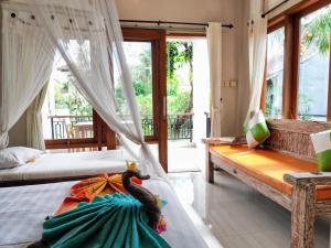 Postel nebo postele na pokoji v ubytování Mandia Bungalows + 37 fotografií