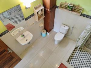 Koupelna v ubytování Mandia Bungalows