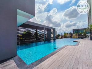 a large swimming pool on the side of a building at Sky Tree by JBcity Home in Johor Bahru