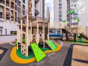 a playground in a apartment complex with a slide at Sky Tree by JBcity Home in Johor Bahru