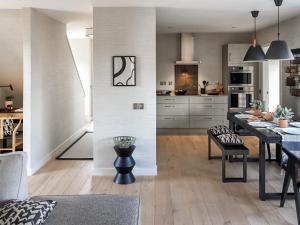 a kitchen and living room with a table and chairs at Miller Time in Croy